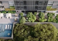 Vista aérea da área de lazer com piscina e muito verde — Blue Forest Residence